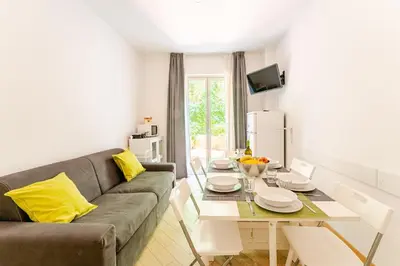 a living room with a couch and a table at St. Peter Garden House in Rome