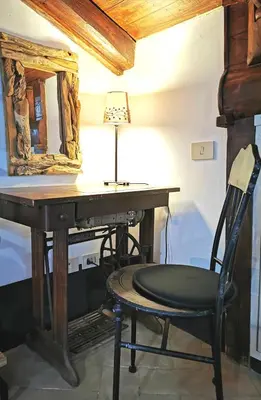 a desk with a chair and a mirror at Casa Nora in Rome