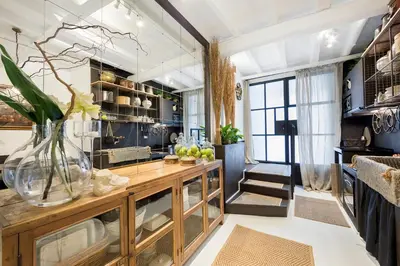 a room with a counter with a vase with flowers in it at Trastevere Gem Cozy Light-filled Retreat in Rome
