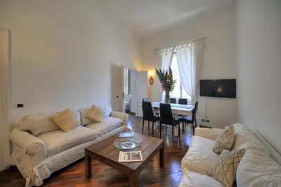 a living room with a couch and a table at Rome Luxury House - The House in Rome