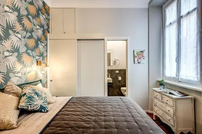 a bedroom with a large bed and a window at Capo Le Case Home 9 in Rome