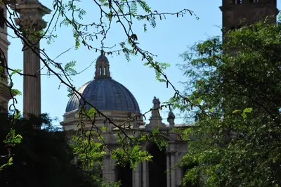 a building with a dome in the background at Vatican Room and Kitchen in Rome