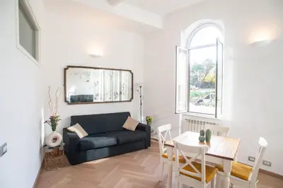 a living room with a couch and a table at COLOSSEUM STREET HoMe in Rome