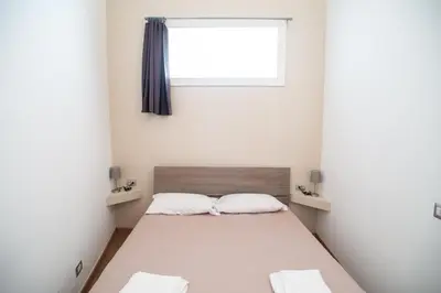 a bedroom with a bed and a window at COLOSSEUM STREET HoMe in Rome