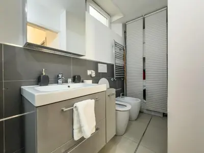 a bathroom with a sink and a toilet at COLOSSEUM STREET HoMe in Rome