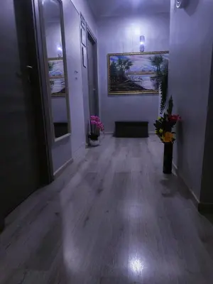 a room with a hallway with a vase of flowers at Napoleone Luxury Home roma in Rome