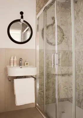 a bathroom with a sink and a shower at Casa Pietra in Rome