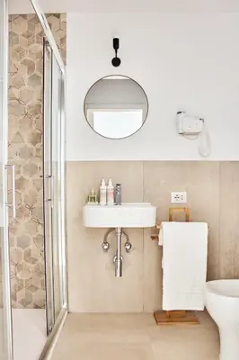 a bathroom with a sink and a shower at Casa Pietra in Rome