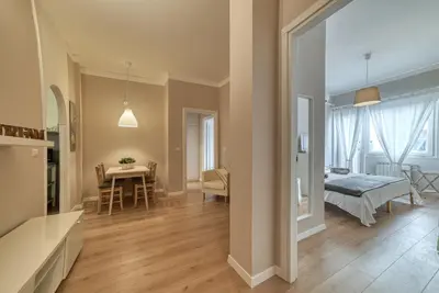 a living room with a table and a dining room at Domus Claudia in Rome
