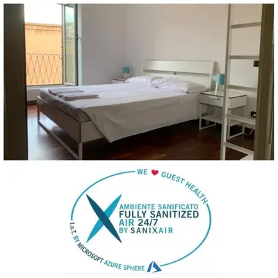 a bedroom with a bed and a sign that says we just hired a luxury mattress at Colosseo Boutique Apartment in Rome