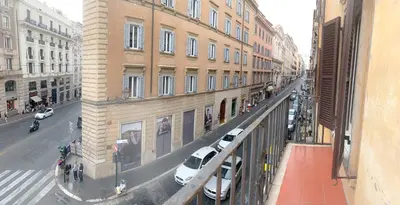 a view of a city street with cars and buildings at Luxury barberini boutique Apartment in Rome