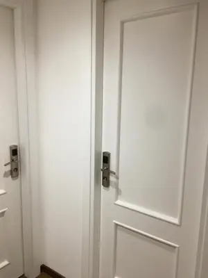 a white door in a room with at Il Faro Gianicolense in Rome