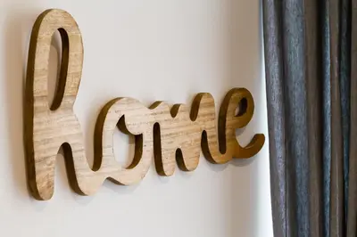 a wooden sign that reads mum next to a curtain at Germanico Luxury Apartment in Rome