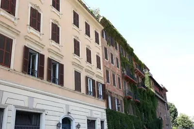 a tall building with ivy growing on the side of it at Loft 5c - Palatino in Rome