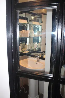 a bathroom with a sink and a mirror at Penelope's House in Rome