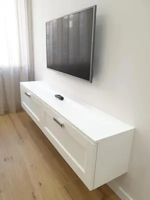 a white dresser with a television on top of it at T&T Luxury Home Rome int 4 in Rome