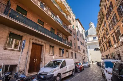 a white van parked on a street next to buildings at Popolo accommodation - Lovely Central apartment in Rome