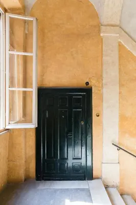 an empty staircase in an old building with a stair case at A World Aparts - 13 T.Argentina in Rome