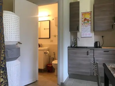 a small kitchen with a sink and a toilet at Suite China Soul - Flaminio - Olimpico - Auditorium in Rome
