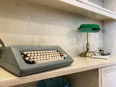 a computer keyboard sitting on top of a desk at GLAM 50 - Exlusive Penthouse in the Heart of Rome in Rome