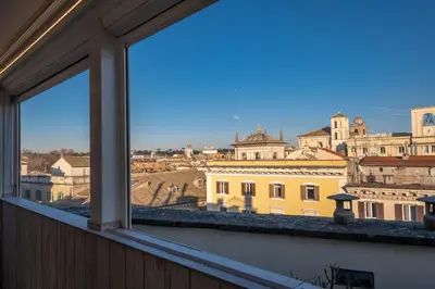 a view of the city from a window at Antica Dimora Delle Cinque Lune in Rome