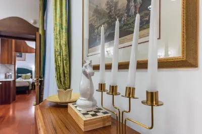 a living room with a couch and a table at Pantheon Antique Suite in Rome