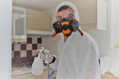 a man wearing a gas mask in a kitchen at Colosseum relax family apartament in Rome
