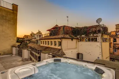 a hot tub on the roof of a building at Casa Argileto in Rome