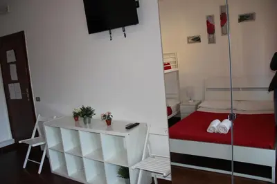 a small room with a small table and a bed at Domus Vatican Holiday's in Rome