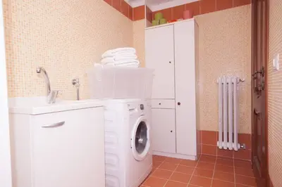 a washing machine in a bathroom with a sink at Easylife in Rome