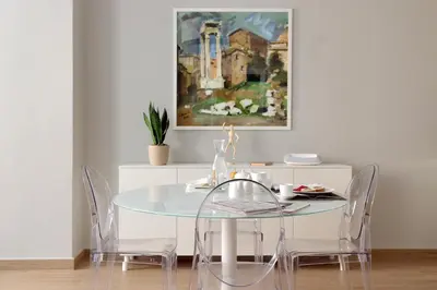 a dining room with a glass table and chairs at Piazzetta Margutta - My Extra Home in Rome