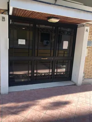 an entrance to a building with glass doors at The Royals in Rome