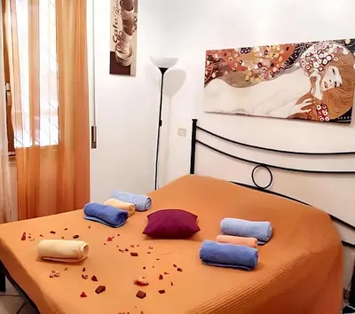 two pillows sitting on top of a bed next toermott at Comfortable studio in Rome 40.2 m² with wifi in Rome
