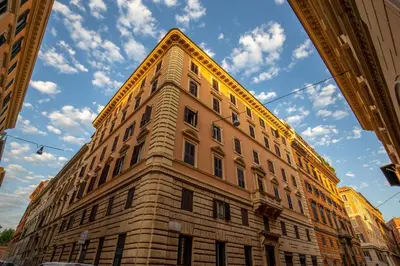 a tall brick building with a sky in the background at Domus Veneto Rome in Rome