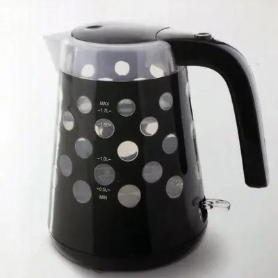 a black and white polka dotted tea kettle at Eucalyptus Resort - Roma San Paolo - in Rome