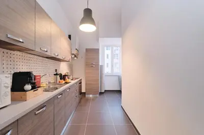 a bedroom with a bed and a dresser and a mirror at Colosseo-Trevi Iconic & Central for 2 ensuite Wi Fi AC in Rome