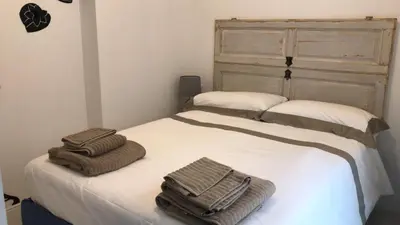 two towels are sitting on top of a bed at CASA DONATELLO con TERRAZZO in Rome