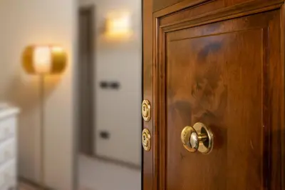 a wooden door with a brass door knob at Nido del Gambero - Your Suite with View in Rome