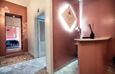 a hallway with a door leading into a room at San Pietro Suite Rome in Rome