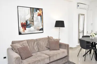 a living room with a couch and a table at Diasof Apartments in Rome