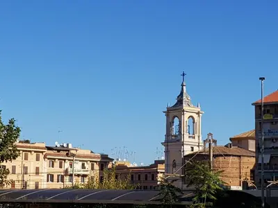 a building with a clock tower in a city at Diasof Apartments in Rome