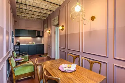 a dining room with a table and chairs at CORNER211 in Rome