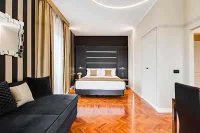 a bedroom with a bed and a couch at Frattina High-end apt in Rome