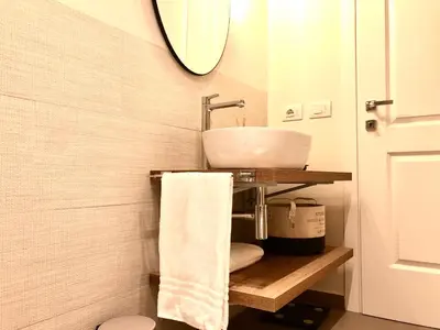 a bathroom with a sink and a mirror at Opera Luxury Rosmini in Rome