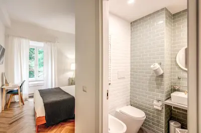 a small bathroom with a toilet and a sink at Trastevere 2.0 in Rome