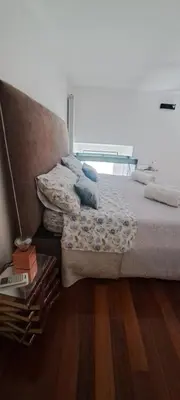 a bedroom with a bed with blue pillows on it at Clementinam Suite Colosseum in Rome
