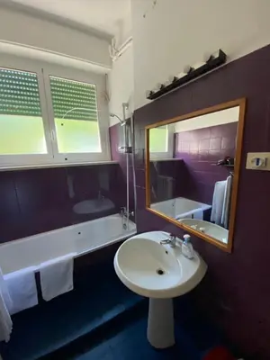 a bathroom with a sink and a tub and a mirror at Suite Marilyn - Flaminio - Olimpico - Auditorium in Rome