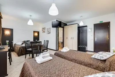 a hotel room with a bed with towels on it at Dreams Of Rome in Rome