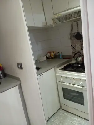 a kitchen with a stove and a white stove top oven at Fantasie in Trastevere in Rome