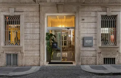 a store front of a building with a glass door at Leonardo Boutique Hotel Rome Monti in Rome